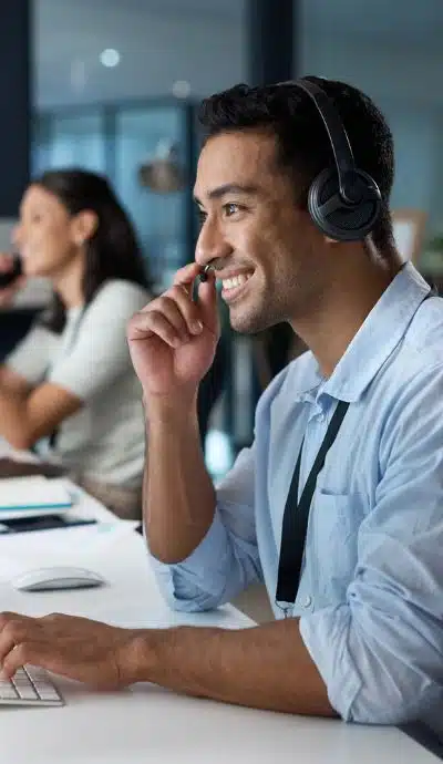 managed it services tech support agent it tech support man wearing a phone headset troubleshooting